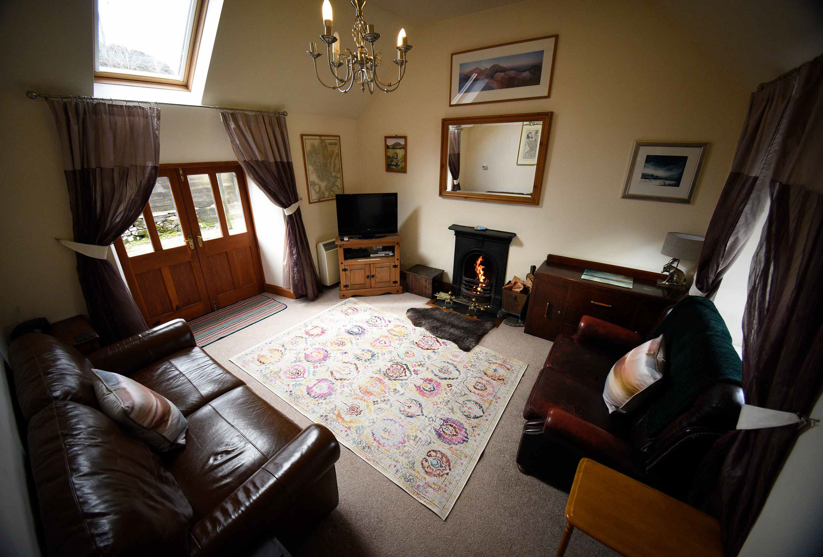 Araucaria Croft Skye self catering accommodation contains an open fireplace at Blossom Cottage 